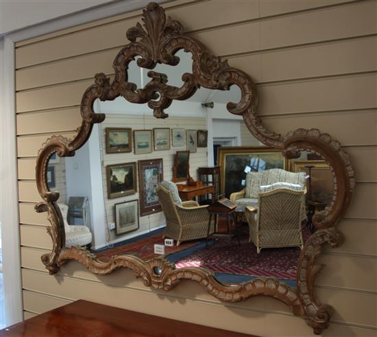 A carved pine cartouche shaped wall mirror H.97cm